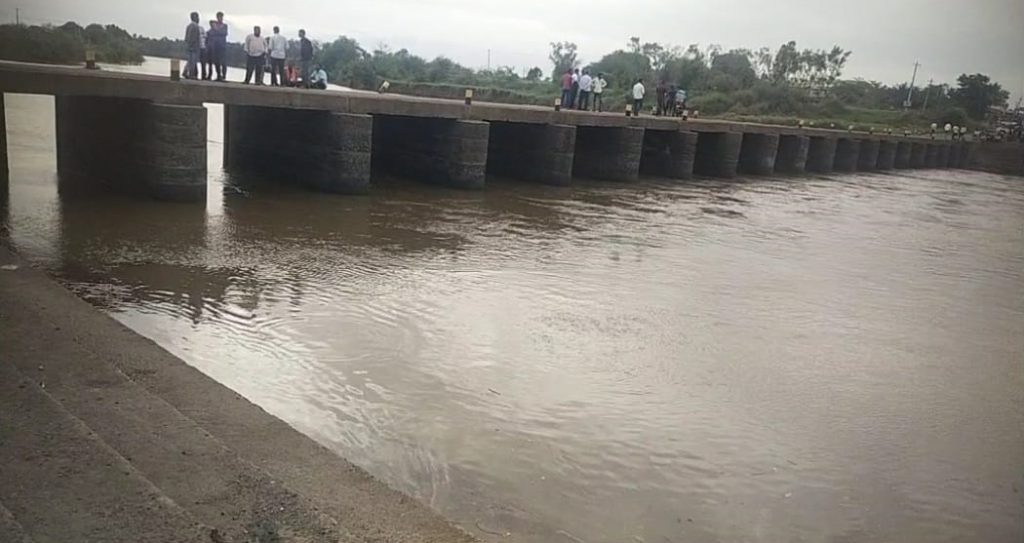 Both were swept away along with the motorcycle