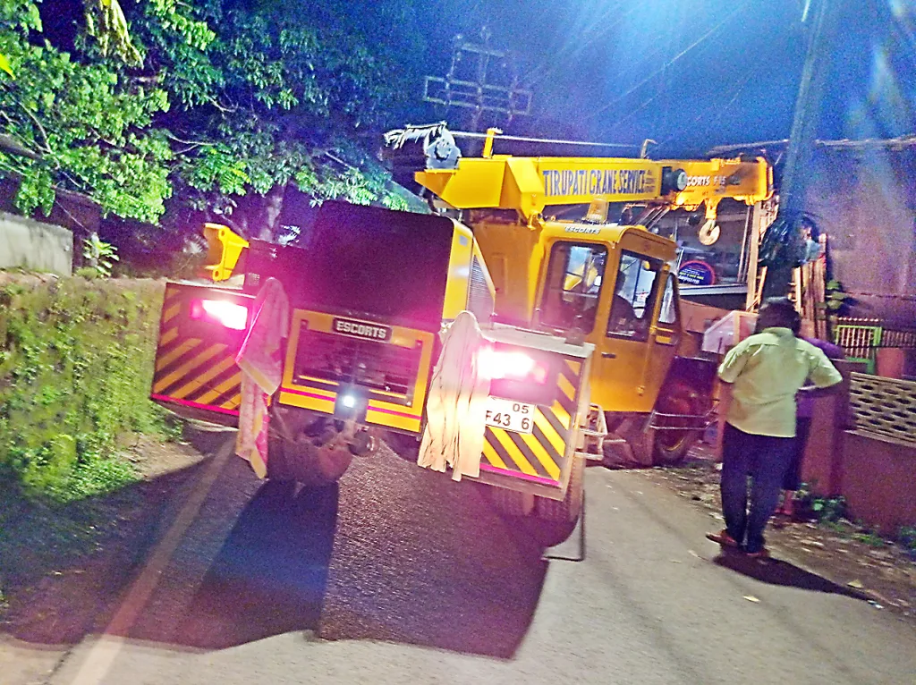 The traffic was blocked by placing the crane horizontally across the road