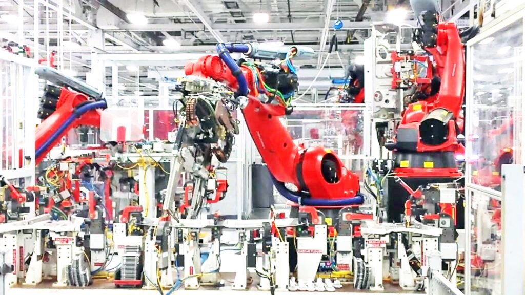 A robot attacks a human in a Tesla company project