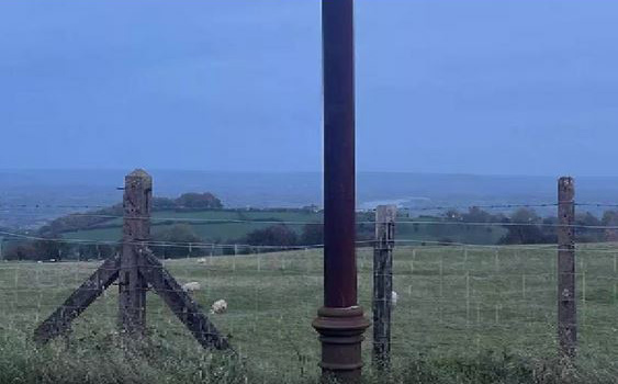 The pillar is rusted...crowded with tourists