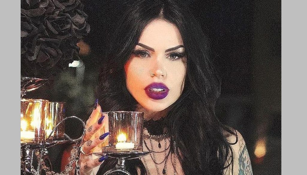 A model drinks lemon juice mixed with her own blood