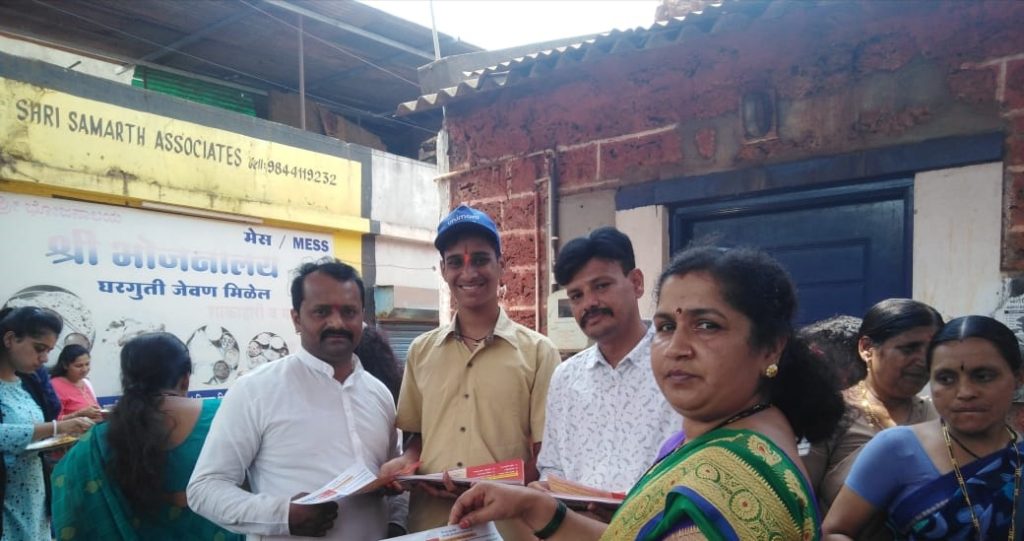 Voting awareness among devotees taking Mahaprasad