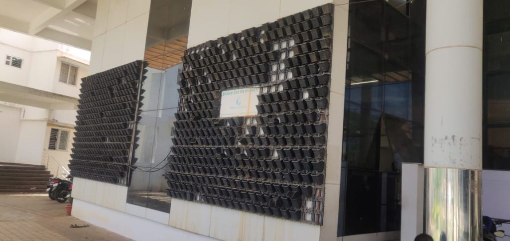 vertical garden pots are hanging