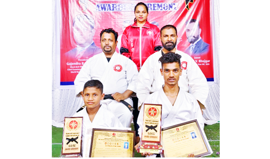 Two students karate black belts